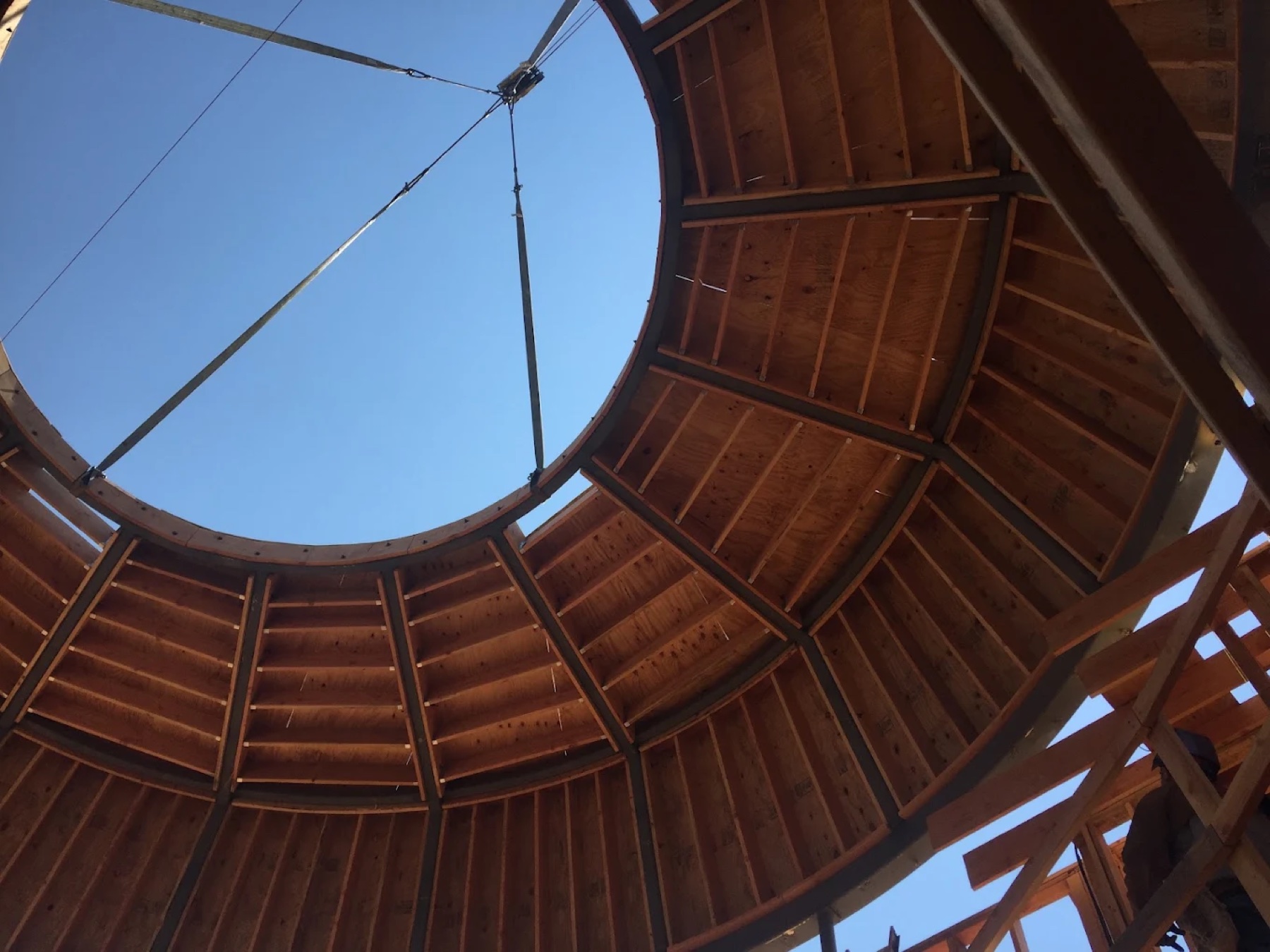 A JDR project under construction — timber-framed rotunda open to the sky